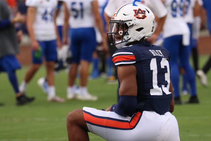 Cam Riley stretches before the Tigers and the Spartans kickoff.